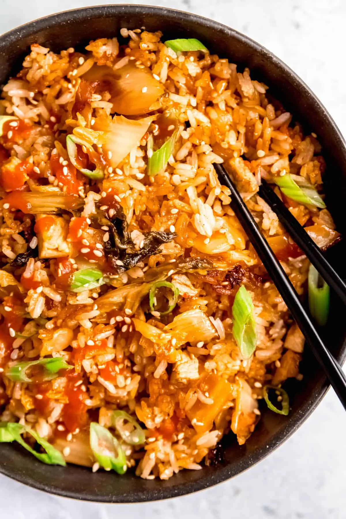 Flat lay shot of a bowl of BBQ pork fried rice as an example of a versatile recipe.