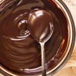 flat lay shot of a bowl of velvety chocolate dip sauce.