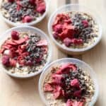 overhead shot of prepped chocolate berry overnight oats in sealable containers.