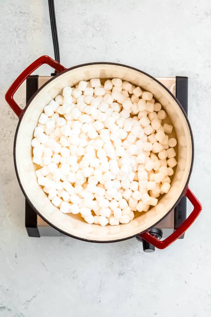 butter and marshmallows melting in a dutch oven.