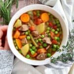 bowl of instant pot beef soup with veggies.