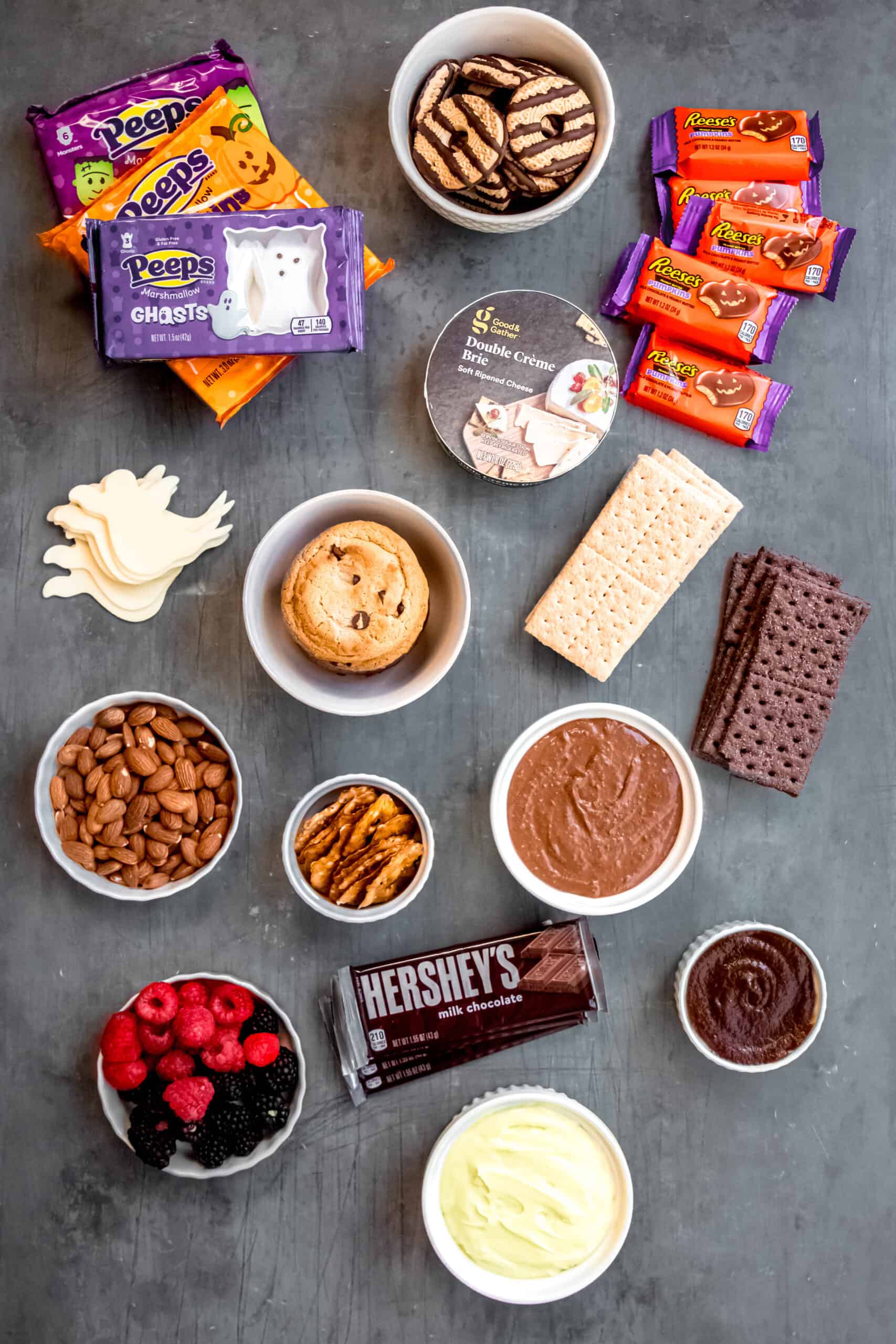 ingredients needed to make a halloween s'mores smorgasbord.