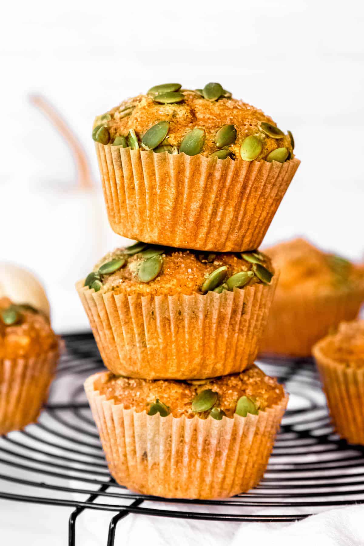stack of 3 banana pumpkin protein muffins without protein powder.