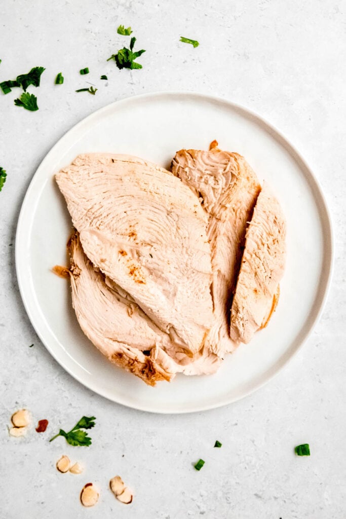 turkey breast that has been sliced after resting.