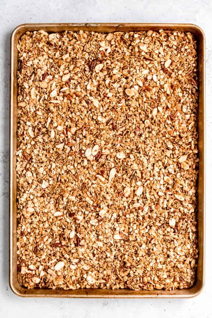 overhead shot of homemade vanilla almond granola after the first bake.
