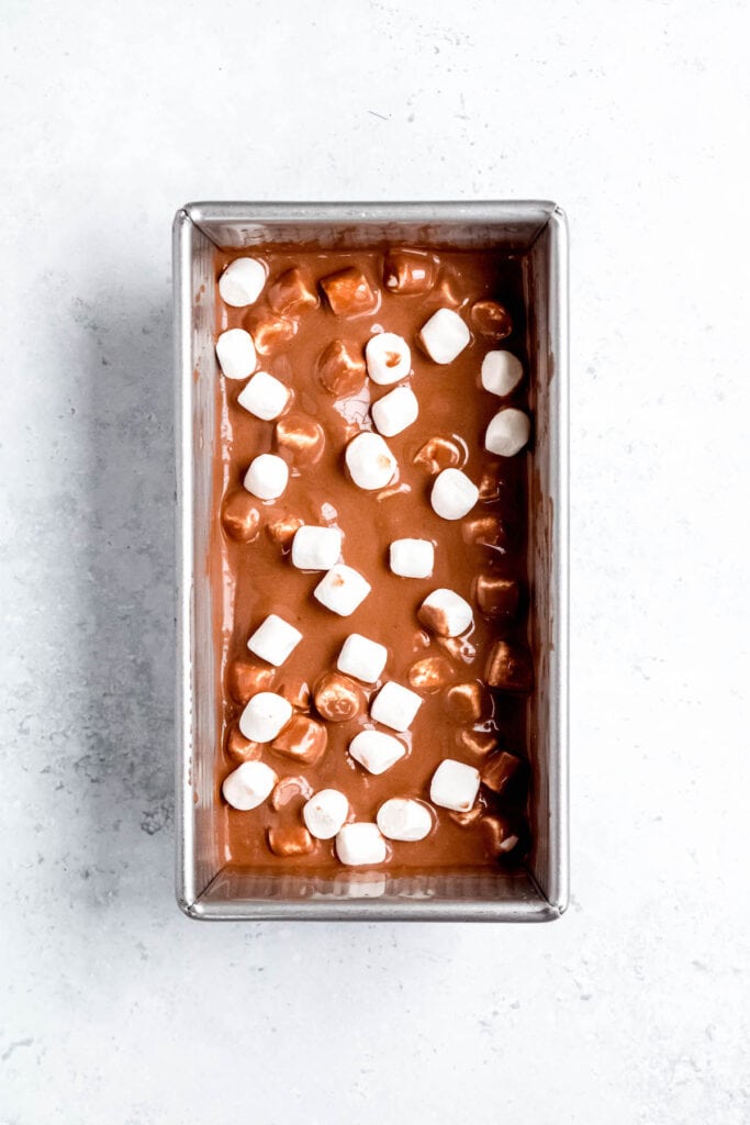 chocolate ice cream with marshmallows after packing into a loaf tin.