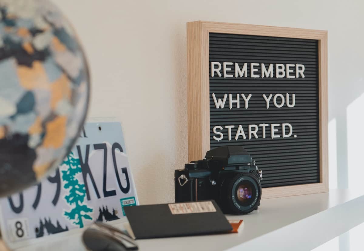 letter board on a shelf with letters that read "remember why you started."