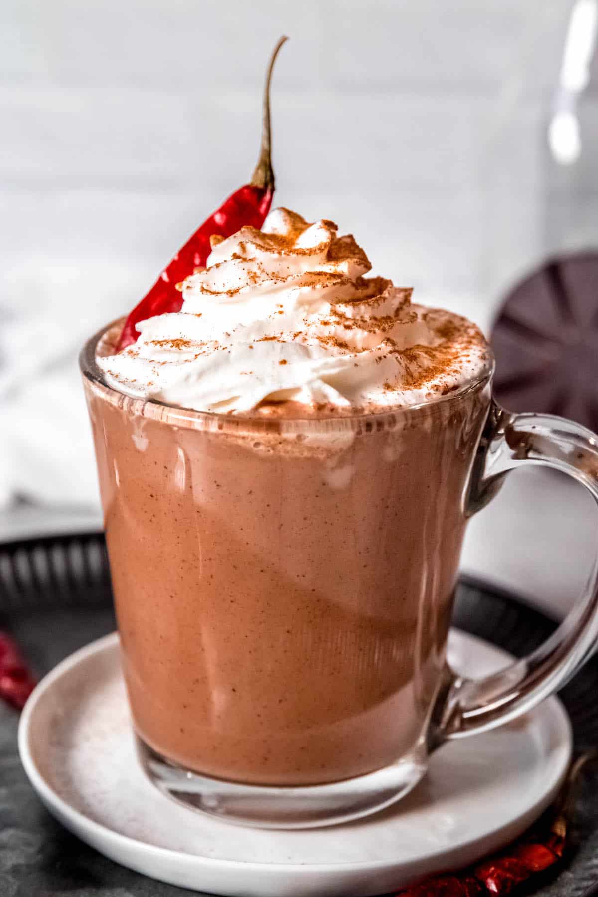 spicy Mexican mocha garnished with whipped cream and a dried chile.