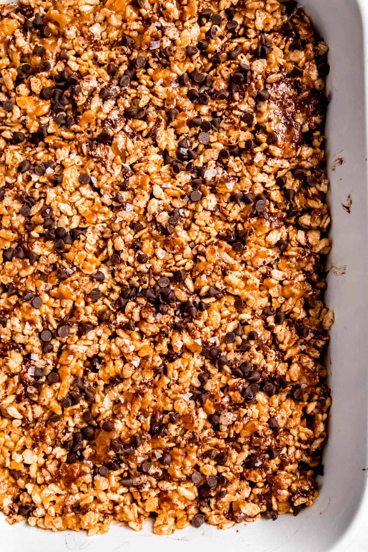 closeup overhead shot of a pan of chocolate chip peanut butter rice krispie treats.