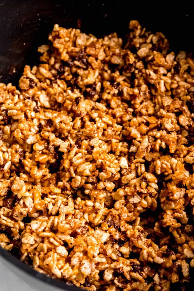 chocolate peanut butter rice crispie treat mixture in the pot after adding chocolate chips.