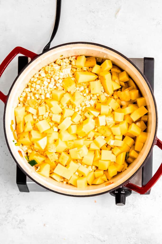 diced potatoes and corn kernels added to the dutch oven with the sautéed aromatics.