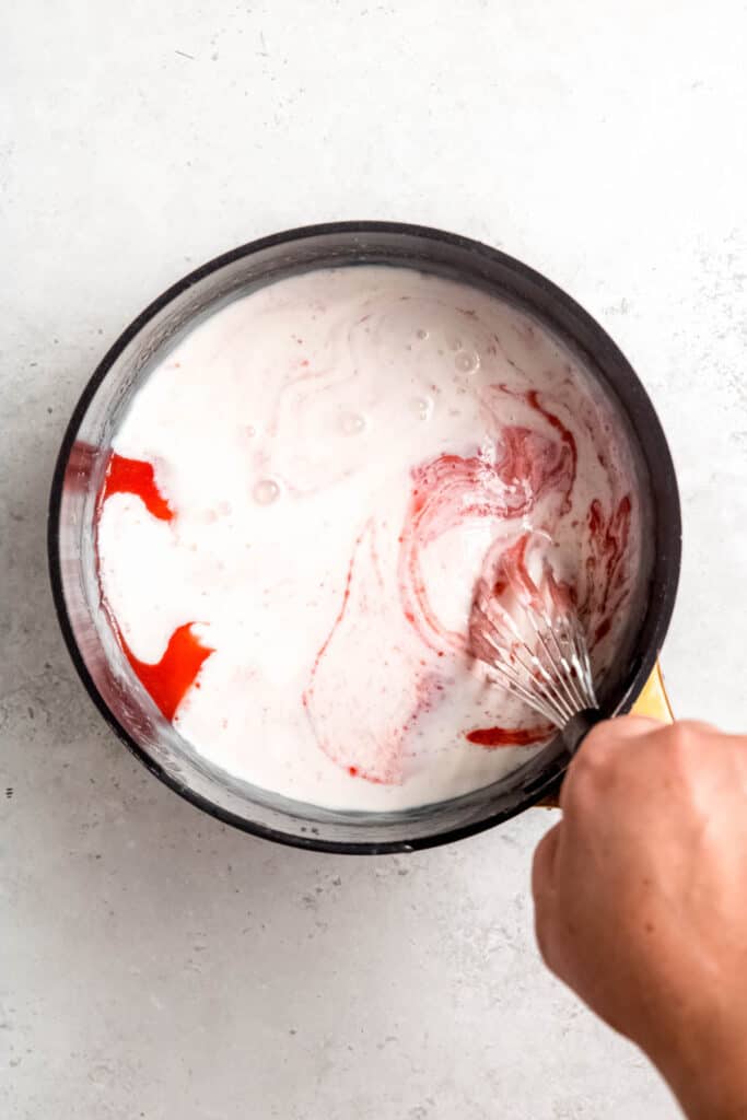 strawberry sauce and buttermilk added to cooked ice cream mixture.