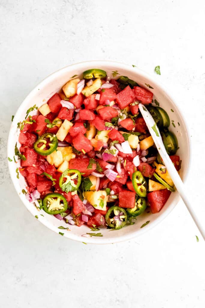 spicy watermelon and pineapple salad after tossing. 