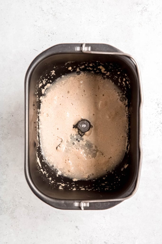 proofing yeast with warm water and sugar in the base of a bread machine.