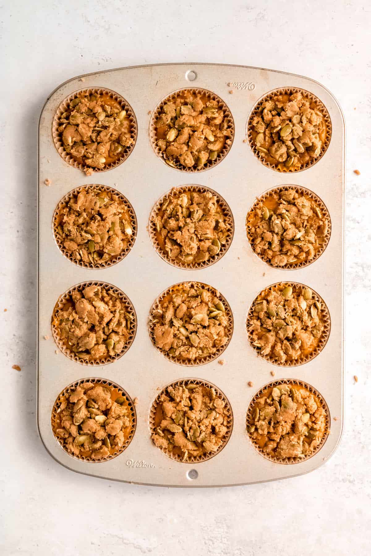 pumpkin spice streusel added to the banana pumpkin muffins before baking.