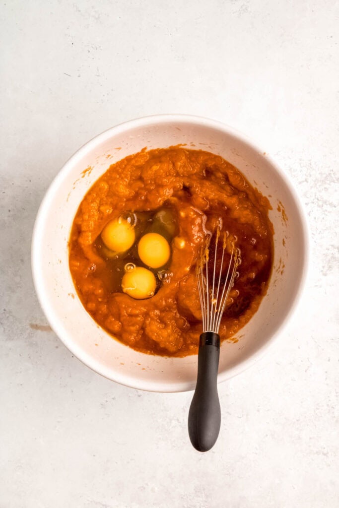 eggs and maple syrup added to the bowl with the wet ingredients.