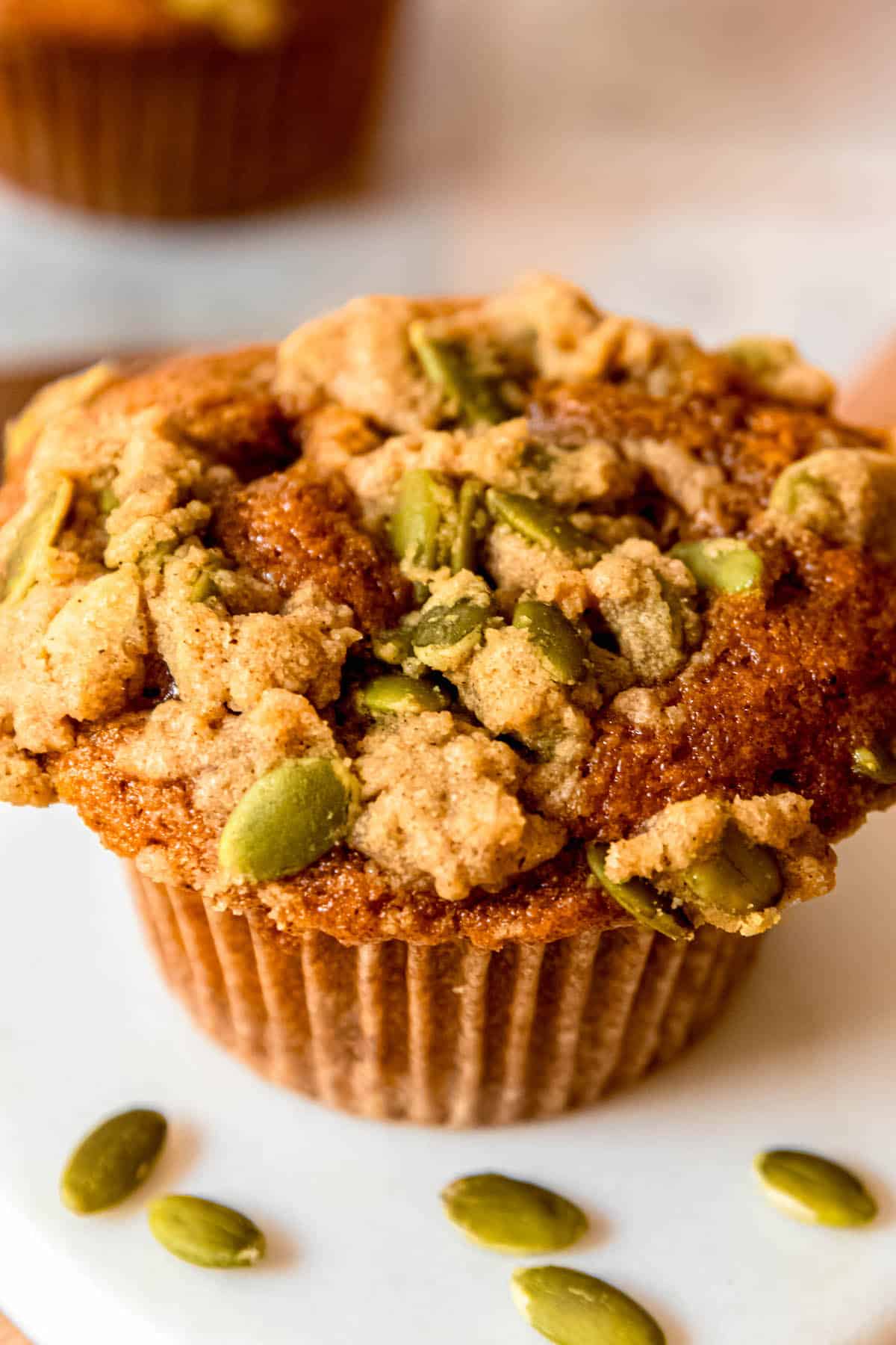 closeup shot of the pumpkin spice streusel topping on a banana pumpkin muffin.