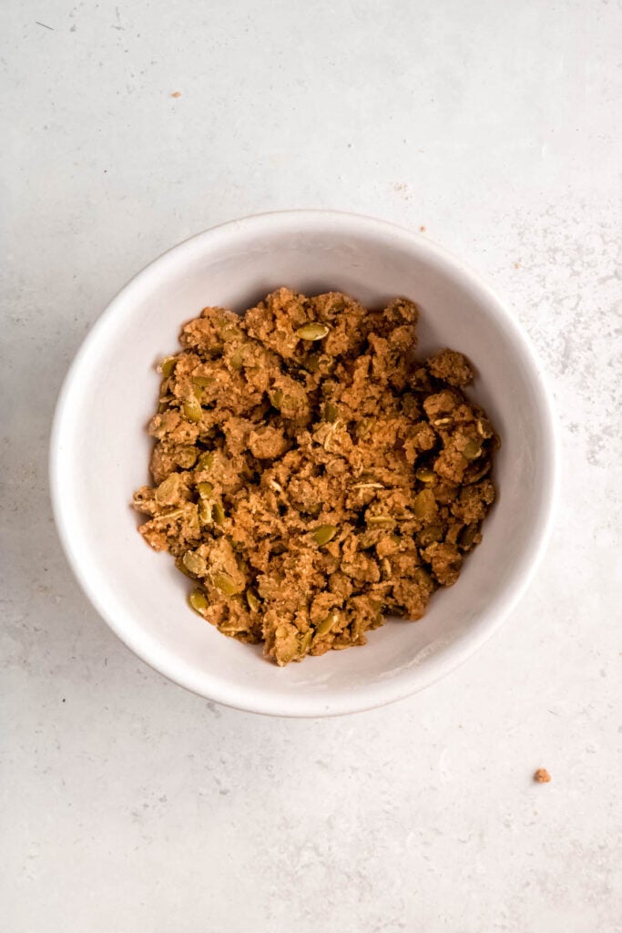 pumpkin streusel topping in a bowl after cutting the butter in.