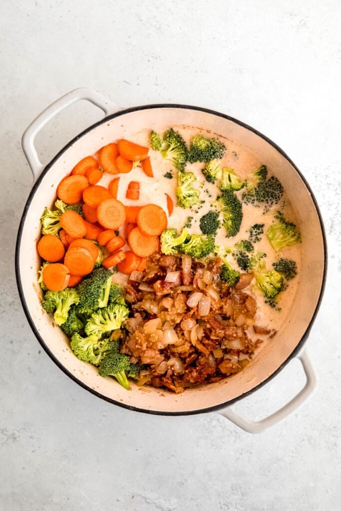 carrots, broccoli florets, and bacon/onion mixture added back to the pot with the roux and liquids.