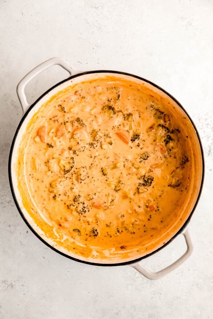 overhead shot of bacon broccoli cheddar soup after stirring in the cheddar cheese.