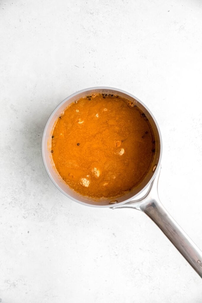 flat lay shot of the turmeric pickling brine ingredients added to a small saucepan.