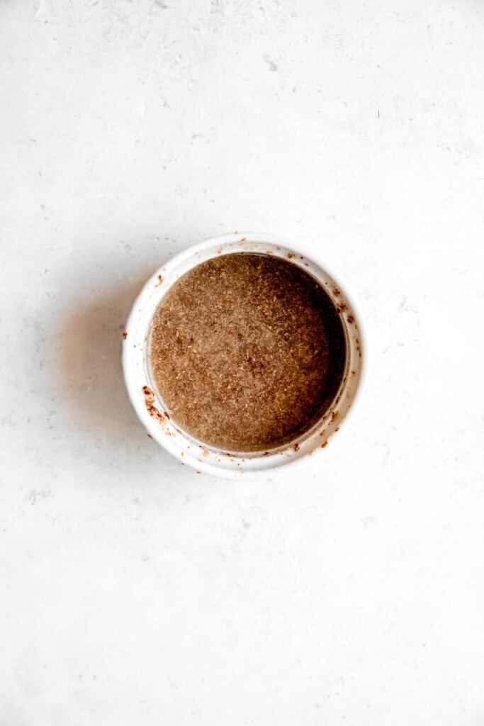 flax eggs in a bowl after stirring the water and flaxmeal together.