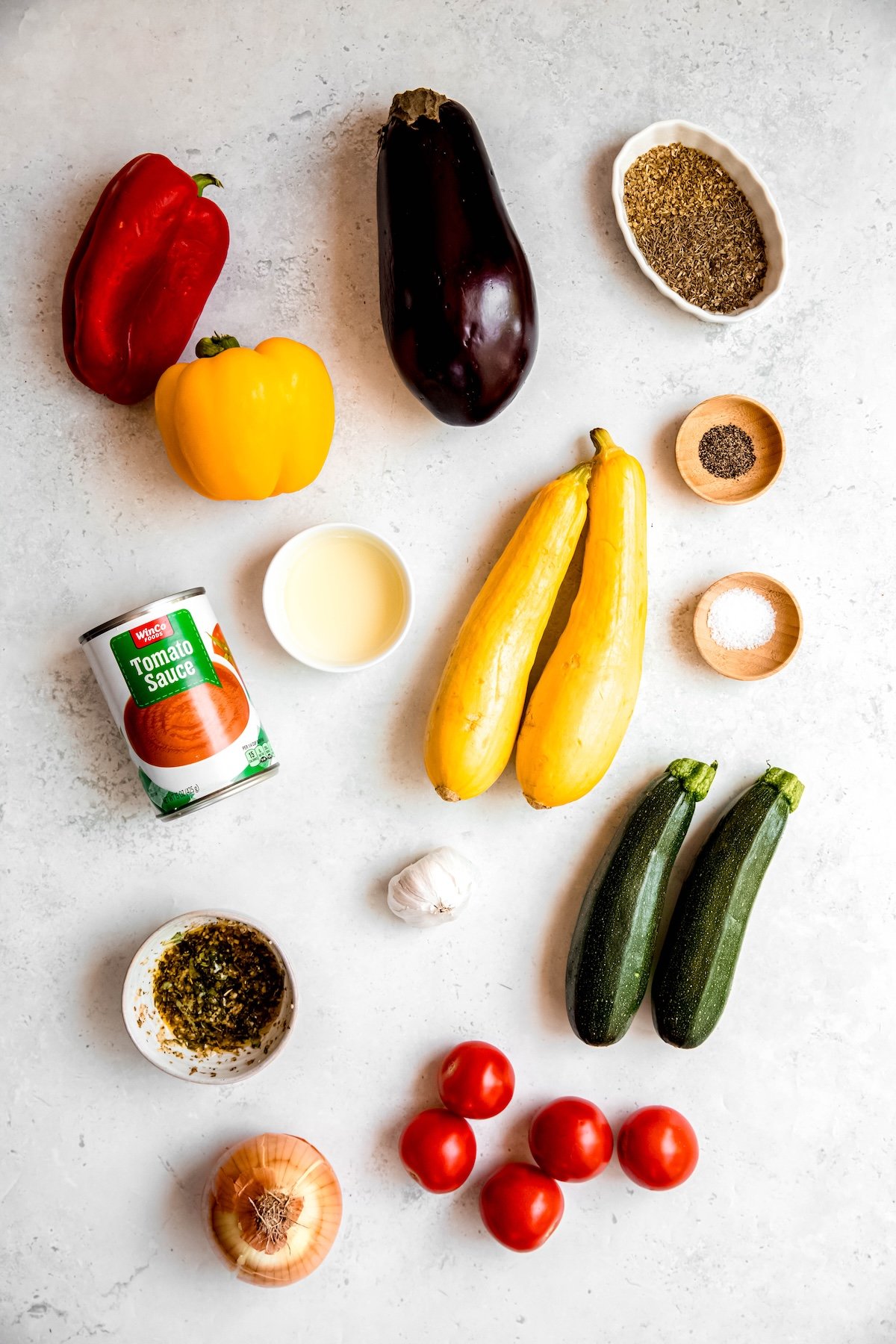ingredients needed to make confit biyaldi style Disney ratatouille recipe measured out on a white table.