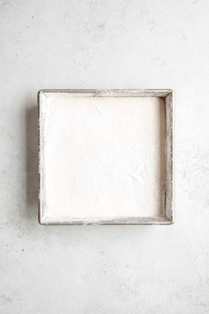 marshmallows in the pan after setting and sprinkling heavily with powdered sugar-cornstarch mixture.