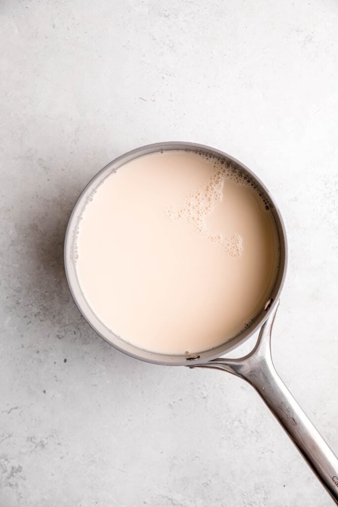milk and broth added to a saucepan.