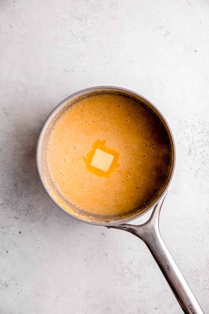 butter added to the pot with the polenta-milk mixture.