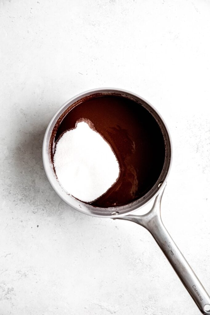 sugar added to the saucepan with the melted chocolate mixture.
