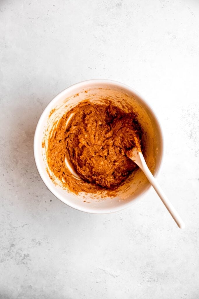 dog biscuit dough after mixing the wet ingredients with the peanut butter powder.