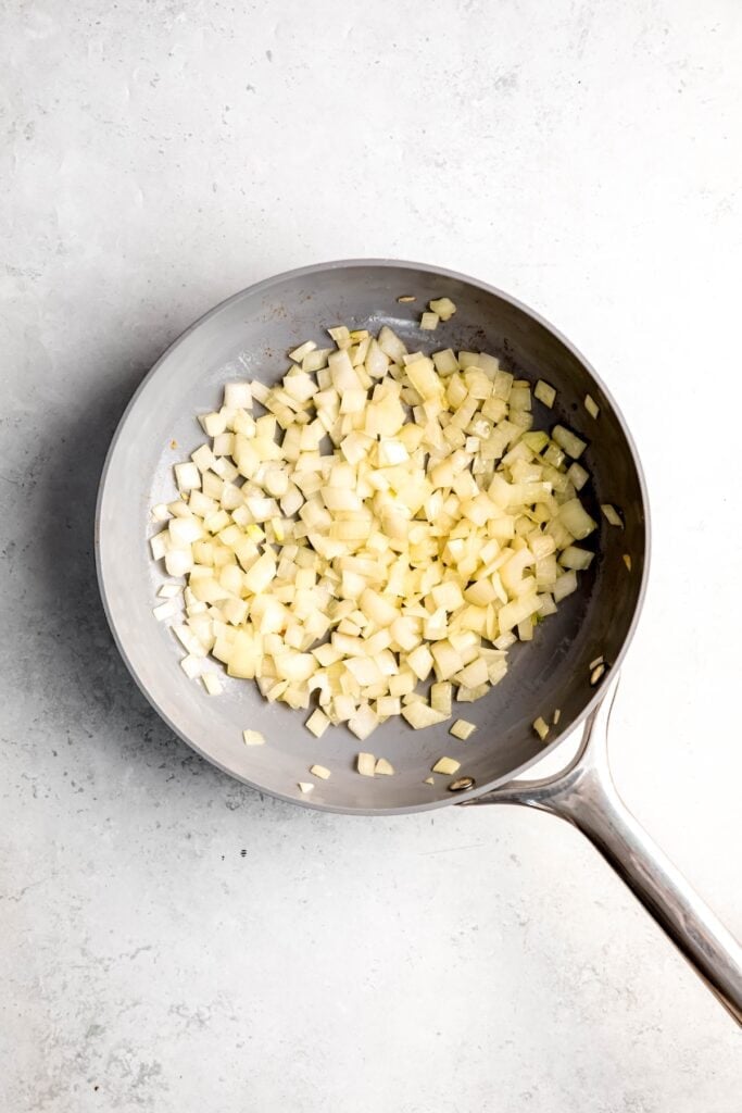 onions sautéing in a skillet.