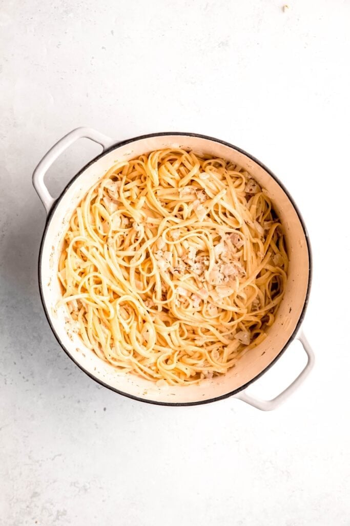 canned clam linguine in the dutch oven after tossing with the creamy sauce.