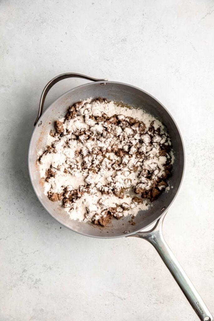 flour added to the skillet with the browned sausage.