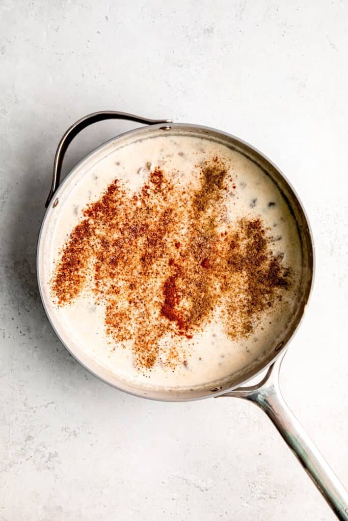 paprika, sage, pepper, and salt added to the gravy mixture for simmering.