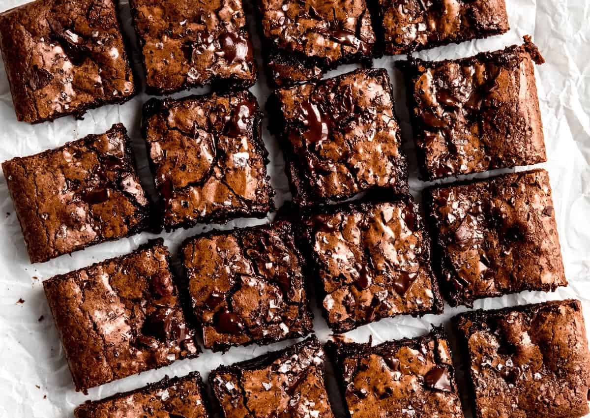 horizontally framed hero shot of Julia Child's dark chocolate brownies with chocolate chunks.