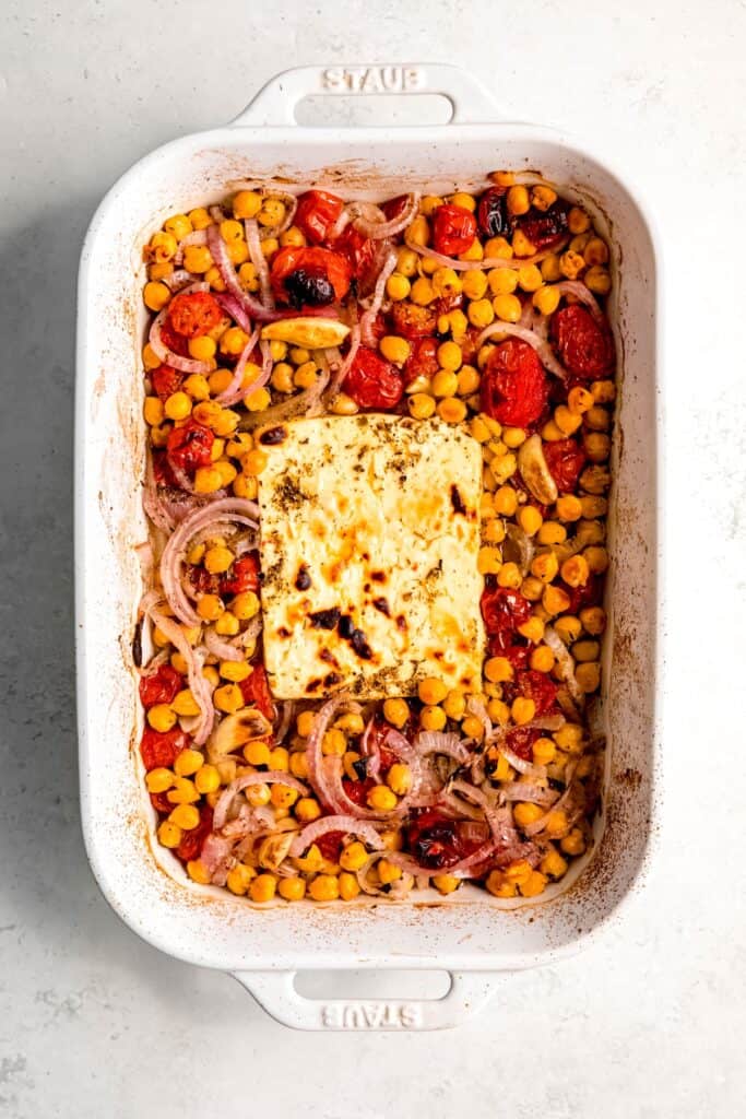 mediterranean baked feta with chickpeas, tomatoes, onions, and jalapeños after broiling.