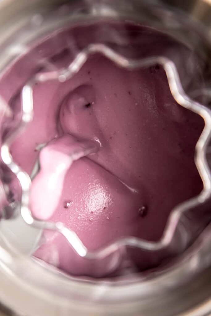 blueberry ice cream churning in the ice cream machine.