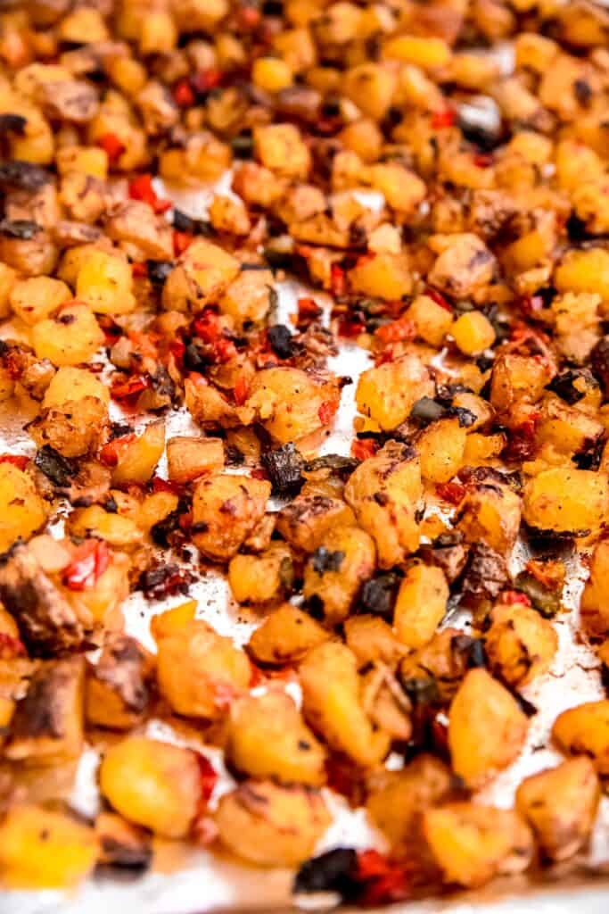 crispy home fries on the sheet pan after baking.