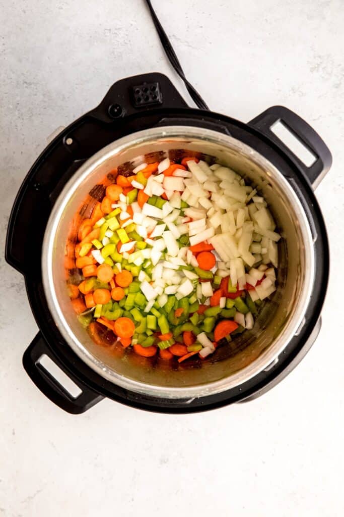 mirepoix added to the instant pot with butter to sauté.