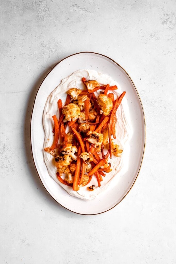 harissa roasted cauliflower and carrots piled on top of the whipped feta.